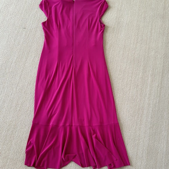 Dress hangs great. Never worn. Ruffles in front and bottom - Picture 5 of 9